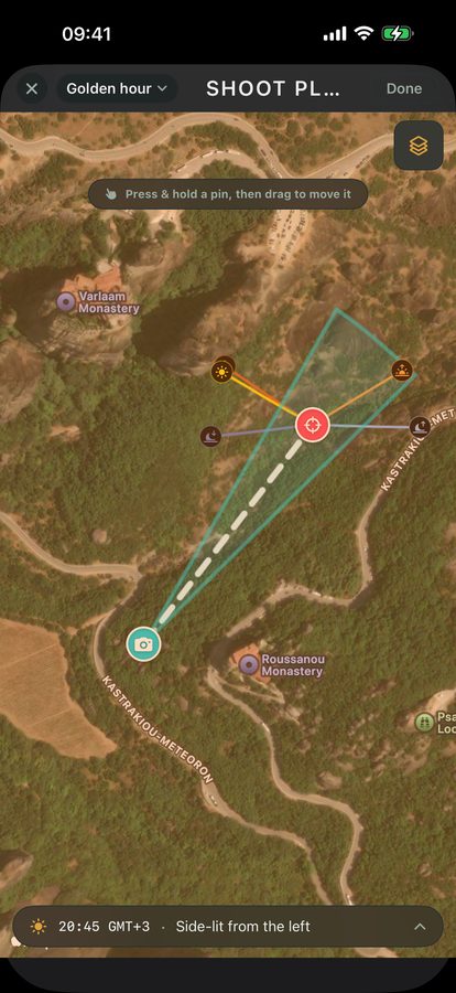 Viewpoint shoot-plan map on a phone, with the sun's path and a bearing line to the subject